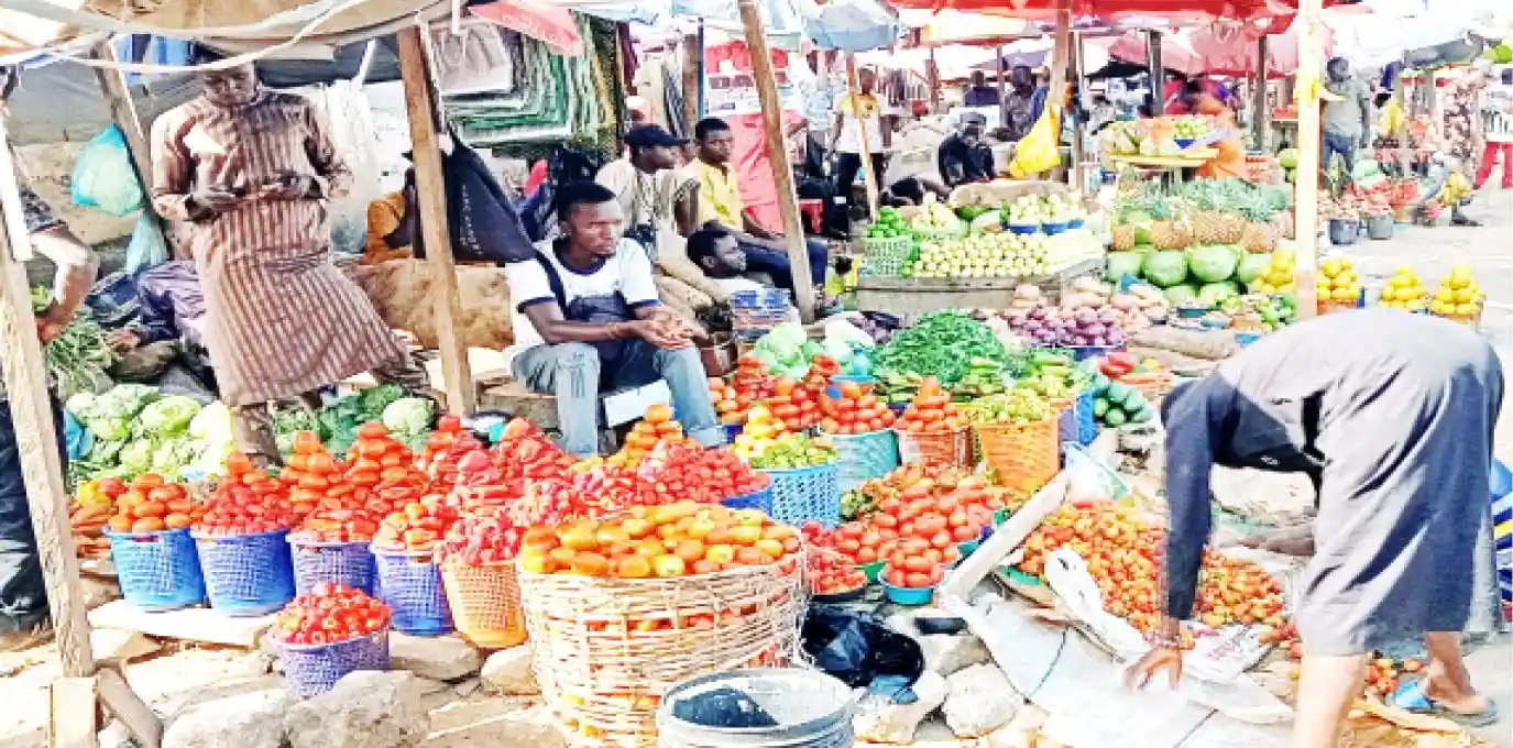Nigeria's Inflation Drops to 14.45% in November, Achieving Tinubu's Target Amid Rebasing Controversy and Persistent Cost-of-Living Pressures